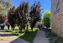 Locals gather outside SDRC meeting to protest mandate