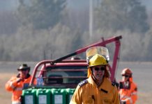 Volunteer firefighter hoses down a half century