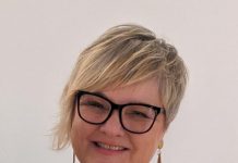 Sue stacks the cups for Protea Place